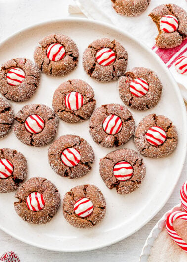 Chocolate Peppermint Kiss Cookies on a white plate.