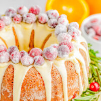 Cranberry Orange Bundt Cake — An elegant yet EASY Bundt cake recipe that only looks like you spent hours on it! This moist and tender cake is flavored with fragrant orange zest, studded with fresh cranberries, and topped with a sweet orange glaze and sugared cranberries! Learn how to make this no-mixer, festive, beautiful dessert that’s PERFECT for any holiday gathering! 