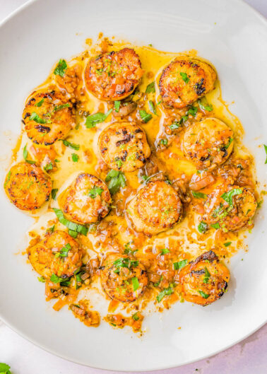 Garlic Butter Scallops - An EASY, one-skillet, 15-minute recipe that tastes restaurant-worthy, yet is incredibly SIMPLE to make at home! Even if you've never made scallops at home before, this is a foolproof recipe for pan-seared, tender, juicy scallops coated in garlic butter with lemon and citrus notes that's sure to IMPRESS! A wonderful choice for a special holiday meal, an anniversary or birthday dinner, or date-night-in!