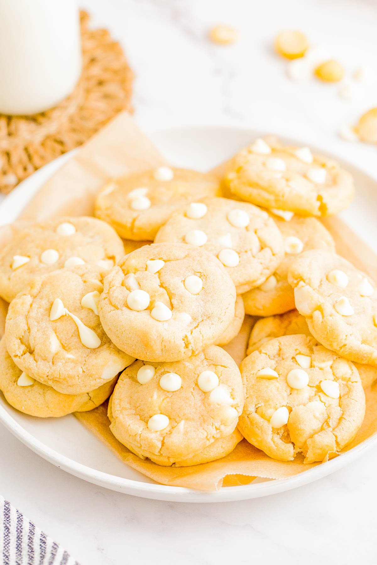 White Chocolate Macadamia Nut Cookies - These EASY white chocolate and macadamia nut cookies are the perfect combination of sweet, nutty, soft and chewy perfection! They're loaded with creamy white chocolate chips and crispy chunks of macadamia nuts and baked until slightly crisp on the outside with a perfectly soft and slightly chewy center. Learn how to make these cookies that are BETTER than from a bakery! 