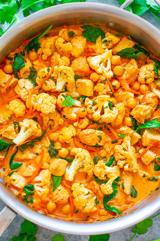 Cauliflower, Chickpea, and Chicken Coconut Curry - An EASY, one-skillet curry that’s ready in 20 minutes and tastes BETTER than a restaurant!! The Thai-inspired coconut milk broth makes this healthy comfort food taste AMAZING!!