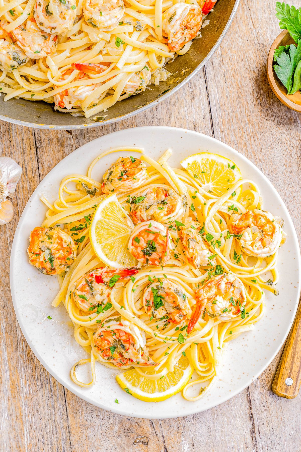 Shrimp Scampi Pasta - Indulge your taste buds with this elegant yet simple Italian-inspired dish! Made with succulent shrimp, zesty lemon, savory parmesan cheese, and al dente cooked pasta, this EASY restaurant-worthy recipe is ready in 15 minutes! PERFECT when you want to impress your guests but don't want to spend all day cooking! Save this one for not only an easy weeknight family dinner, but also for special occasions including holiday dinners, birthdays, anniversaries, or a date-night-in.