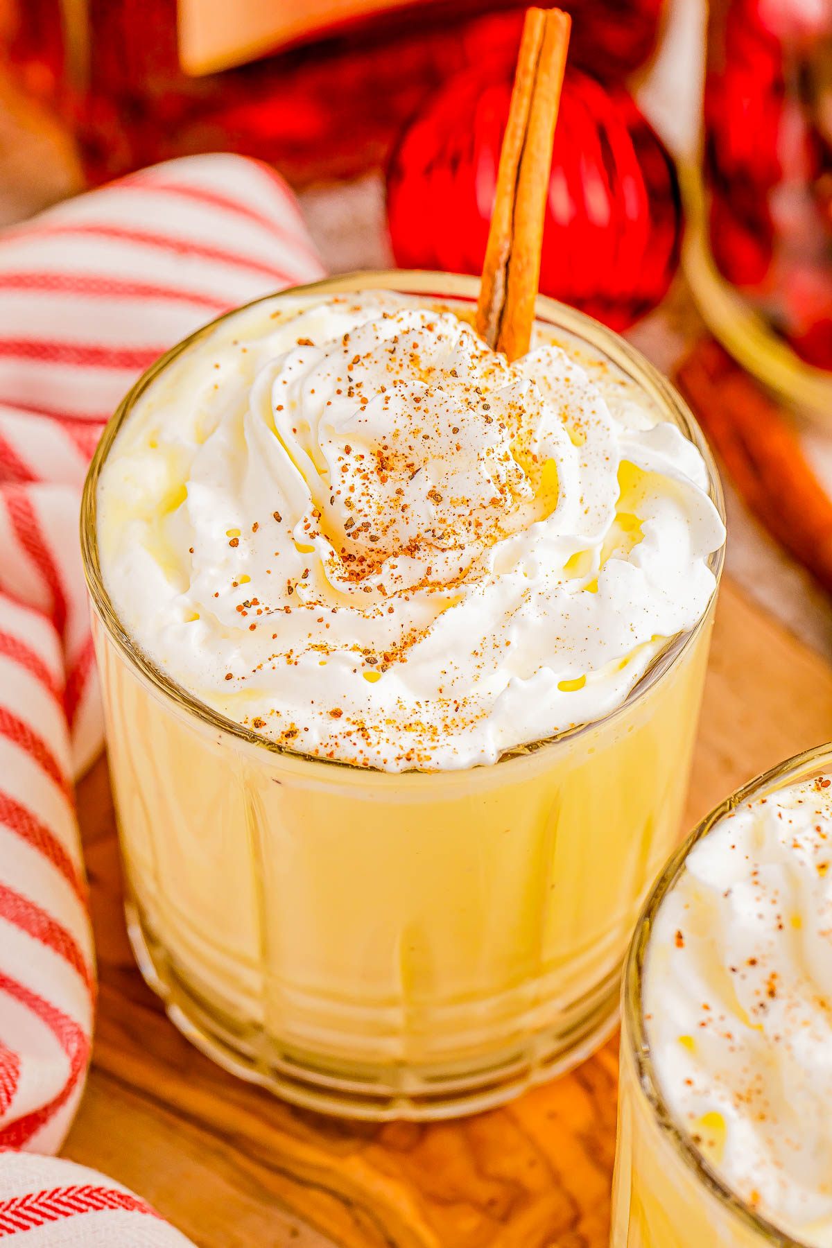 Spiked Eggnog with Amaretto and Spiced Rum - Wondering what to do with your eggnog? Making this EASY three-ingredient spiked eggnog cocktail recipe is the PERFECT idea! Smooth, rich and creamy with warm hints of cinnamon, cloves, and vanilla from the spiced rum and almond from the amaretto. Spiked eggnog will be a hit at your Christmas parties and New Years Eve party! Instructions on how to make a large batch or pitcher are provided.