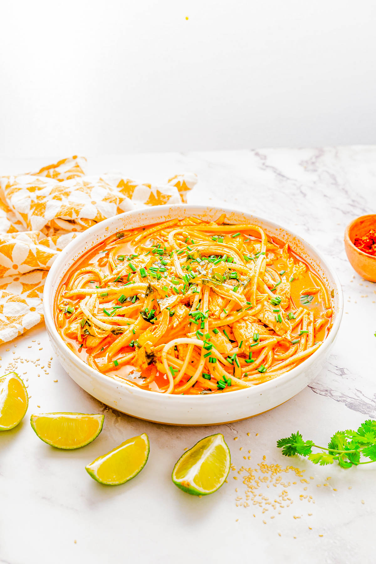 Thai Noodle Soup with Chicken - Recreate this Thai restaurant-inspired soup at home in 20 minutes! An EASY, one-pot recipe for this comforting soup made with shredded chicken, Thai red curry paste, coconut milk, basil, cilantro, green onions, and more! Healthy comfort food never tasted so good!