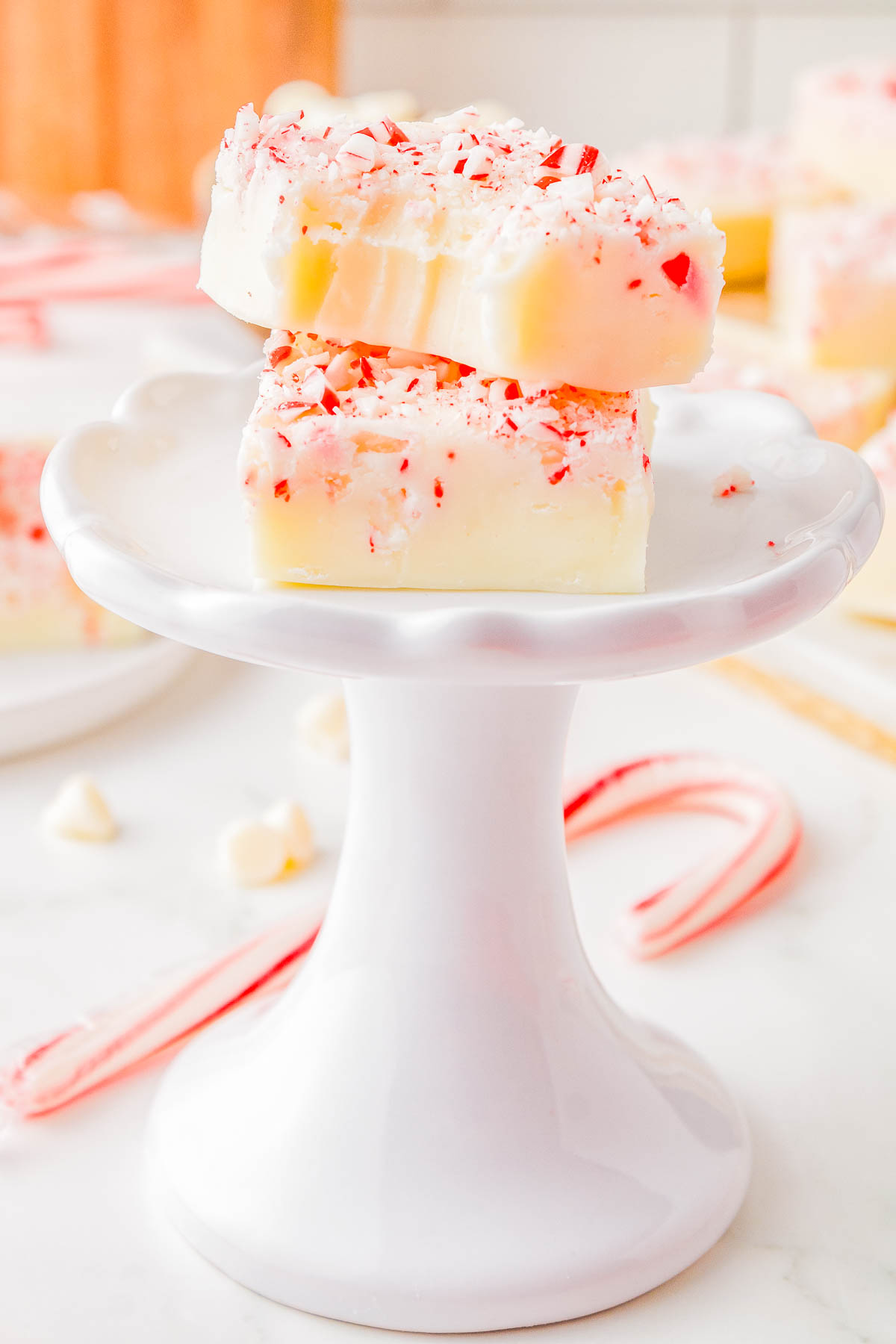 White Chocolate Peppermint Fudge - A FOOLPROOF recipe for fudge with no boiling, no candy thermometers, and it turns out PERFECTLY every time! This EASY recipe uses just 4 INGREDIENTS, can be made ahead of time, and is great for holiday entertaining! It's creamy and rich with a peppermint crunch, making it a wonderfully festive treat!