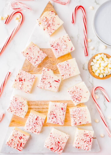 White Chocolate Peppermint Fudge - A FOOLPROOF recipe for fudge with no boiling, no candy thermometers, and it turns out PERFECTLY every time! This EASY recipe uses just 4 INGREDIENTS, can be made ahead of time, and is great for holiday entertaining! It's creamy and rich with a peppermint crunch, making it a wonderfully festive treat!
