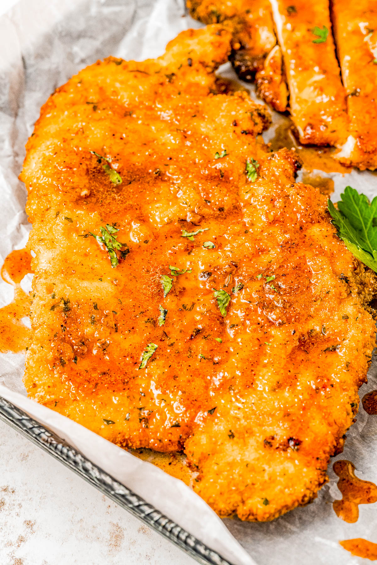 Air Fryer Hot Honey Chicken — Breaded chicken cutlets are air fried until crispy, then drizzled with spicy-sweet hot honey! This is such a QUICK and EASY air fryer chicken recipe that takes less than 30 minutes to prepare! Oven-baking instructions are also provided.