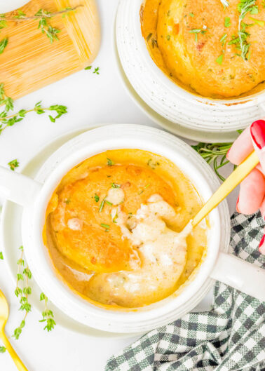 Biscuit and Sausage Gravy Pots — Individual ramekins are filled with homemade sausage gravy and topped with homemade flaky cheese and herb biscuits before being baked and served piping hot! Biscuits and gravy pots are an elevated and more elegant way to serve this family FAVORITE comfort food for anything from brunch to family dinner! If you don’t have any ramekins, don’t worry, you can make this recipe without them.