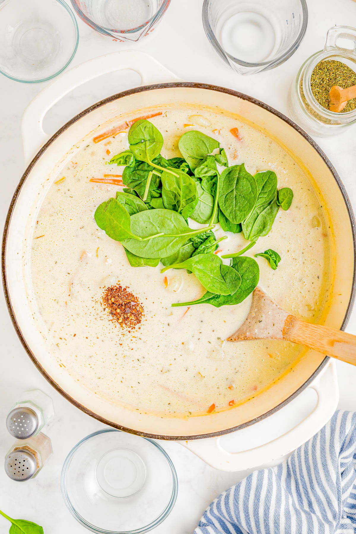Chicken Gnocchi Soup - This Olive Garden Copycat recipe is so EASY, made in one pot, and ready in just 30 minutes! There's an abundance of chicken and tender gnocchi, along with onions, carrots, and garlic for layers of flavor. Fresh spinach adds texture while the creamy broth makes this the ULTIMATE comfort food soup recipe that the whole family will LOVE! We think it's even BETTER than the restaurant version!