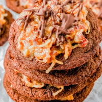 German Chocolate Cookies — An EASY recipe for soft, chewy, fudgy chocolate cookies that are topped with a rich and creamy pecan coconut frosting! If you love German chocolate cake but don’t want to deal with layering and frosting an entire cake, these cookies are PERFECT! Great for holiday cookie platters, Valentine's Day, or 'just because'! They're a Crumbl Cookies copycat and I promise that this homemade version is BETTER!