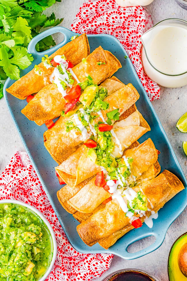 Air Fryer Chicken Taquitos - All the flavor of the chicken taquitos in your favorite Mexican restaurant, but healthier because these are air fried! Crispy and crunchy on the outside with a perfectly spicy chicken, cheese, and cream cheese filling mixture that just melts in your mouth! EASY, ready in 20 minutes, and the whole family will want seconds! 