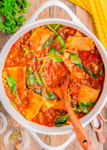 Lasagna Soup with Ground Beef - Ready in 30 minutes and made in one pot, this EASY lasagna soup is the perfect, hearty, comfort food recipe! Big chunks of ground beef, tender noodles, a tomato-based broth, and topped with a three-cheese mixture of ricotta, mozzarella, and Parmesan! If you like lasagna, you're going to LOVE this soup version of the Italian classic!