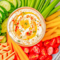 Whipped Feta Dip - Ready in just 5 minutes and made with feta cheese, Greek yogurt, lemon, garlic, olive oil, and a variety of spices, this creamy and EASY dip is a FAVORITE! Just the right amount of tangy-salty-creamy! It's PERFECT for holiday or casual entertaining, game day parties, or summertime backyard get-togethers and everyone will want the recipe!