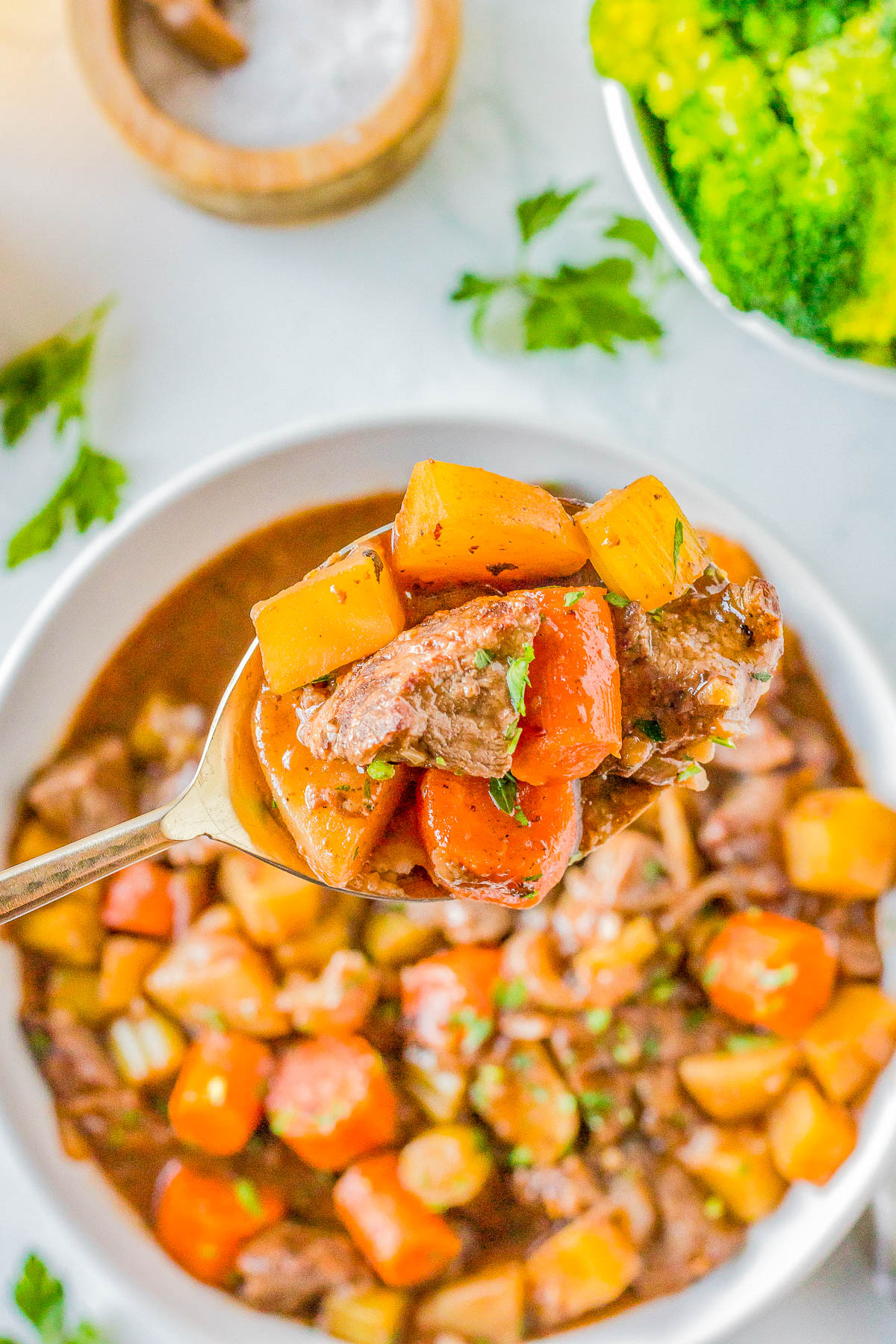 Old-Fashioned Beef Stew — A EASY stovetop recipe that features succulent pieces of beef with tender carrots and potatoes, all coated in a rich gravy! Make this COMFORT FOOD classic all winter long. It’s a simple recipe with minimal ingredients and very little hands on prep that the whole family will adore!