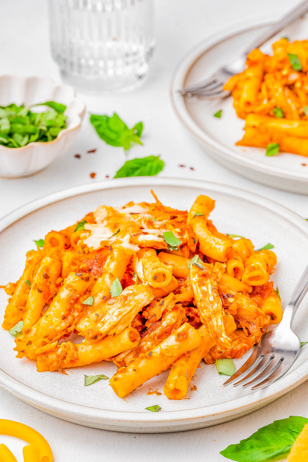 Baked Ziti with Chicken — A FAST and EASY pasta bake made with al dente ziti, juicy chicken, marinara sauce, and two types of CHEESE for the ultimate comfort food casserole! Ready in 45 minutes, perfect for weeknight dinners or casual family get-togethers, and picky eater approved! Use pasta that's in your pantry, a jar of marinara, rotisserie chicken, cheese, and you're set - nothing too fancy or complicated here and planned leftovers are a bonus!