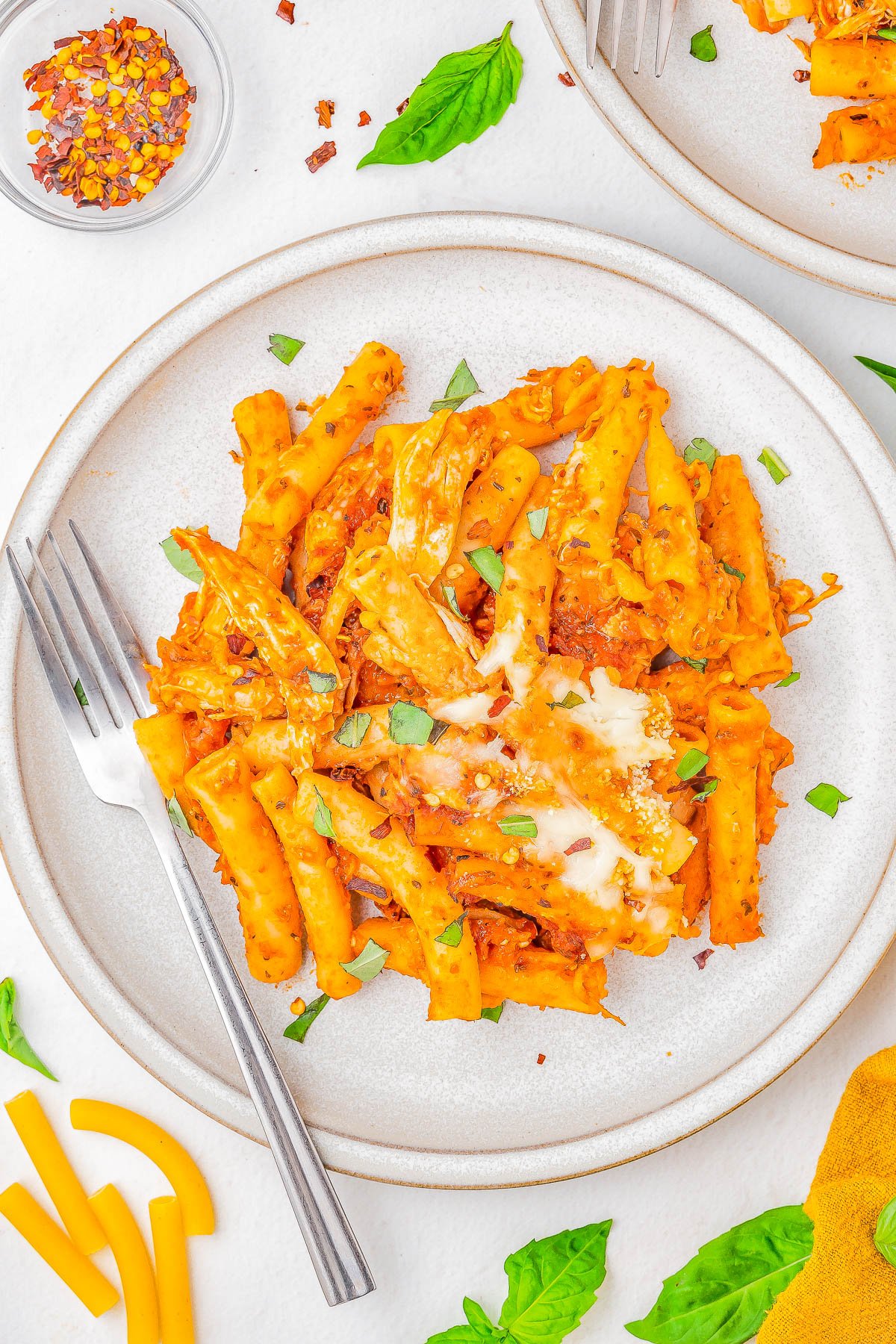 Baked Ziti with Chicken — A FAST and EASY pasta bake made with al dente ziti, juicy chicken, marinara sauce, and two types of CHEESE for the ultimate comfort food casserole! Ready in 45 minutes, perfect for weeknight dinners or casual family get-togethers, and picky eater approved! Use pasta that's in your pantry, a jar of marinara, rotisserie chicken, cheese, and you're set - nothing too fancy or complicated here and planned leftovers are a bonus!