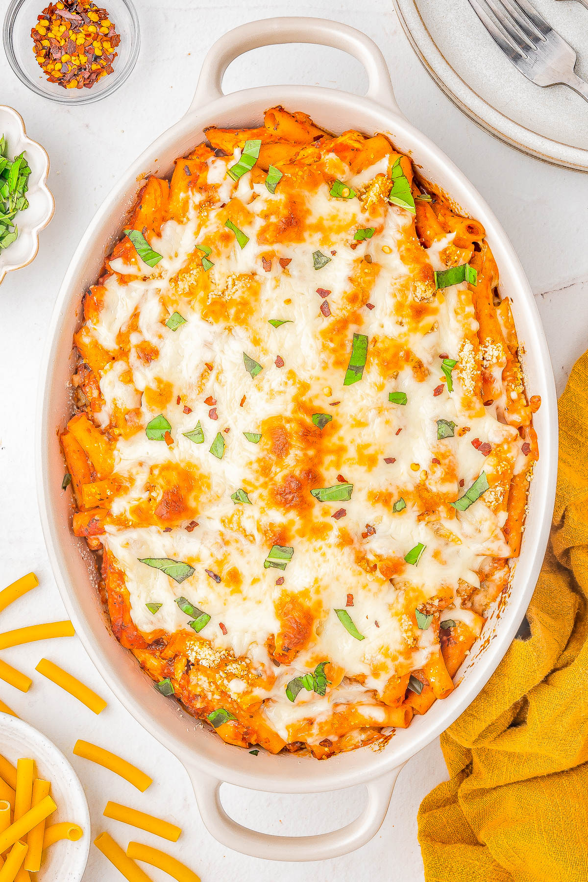 Baked Ziti with Chicken — A FAST and EASY pasta bake made with al dente ziti, juicy chicken, marinara sauce, and two types of CHEESE for the ultimate comfort food casserole! Ready in 45 minutes, perfect for weeknight dinners or casual family get-togethers, and picky eater approved! Use pasta that's in your pantry, a jar of marinara, rotisserie chicken, cheese, and you're set - nothing too fancy or complicated here and planned leftovers are a bonus! 
