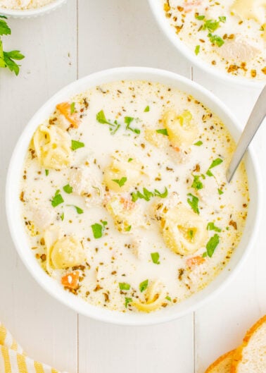 Creamy Chicken Tortellini Soup - Ready in just 30 minutes, and made in one pot, this EASY soup is a comfort food family favorite! Tender chicken, vegetables, and plenty of cheese tortellini in a super rich and creamy broth make this the PERFECT cold weather meal. Simple to make for lunch or busy weeknight dinners because it comes together so quickly!