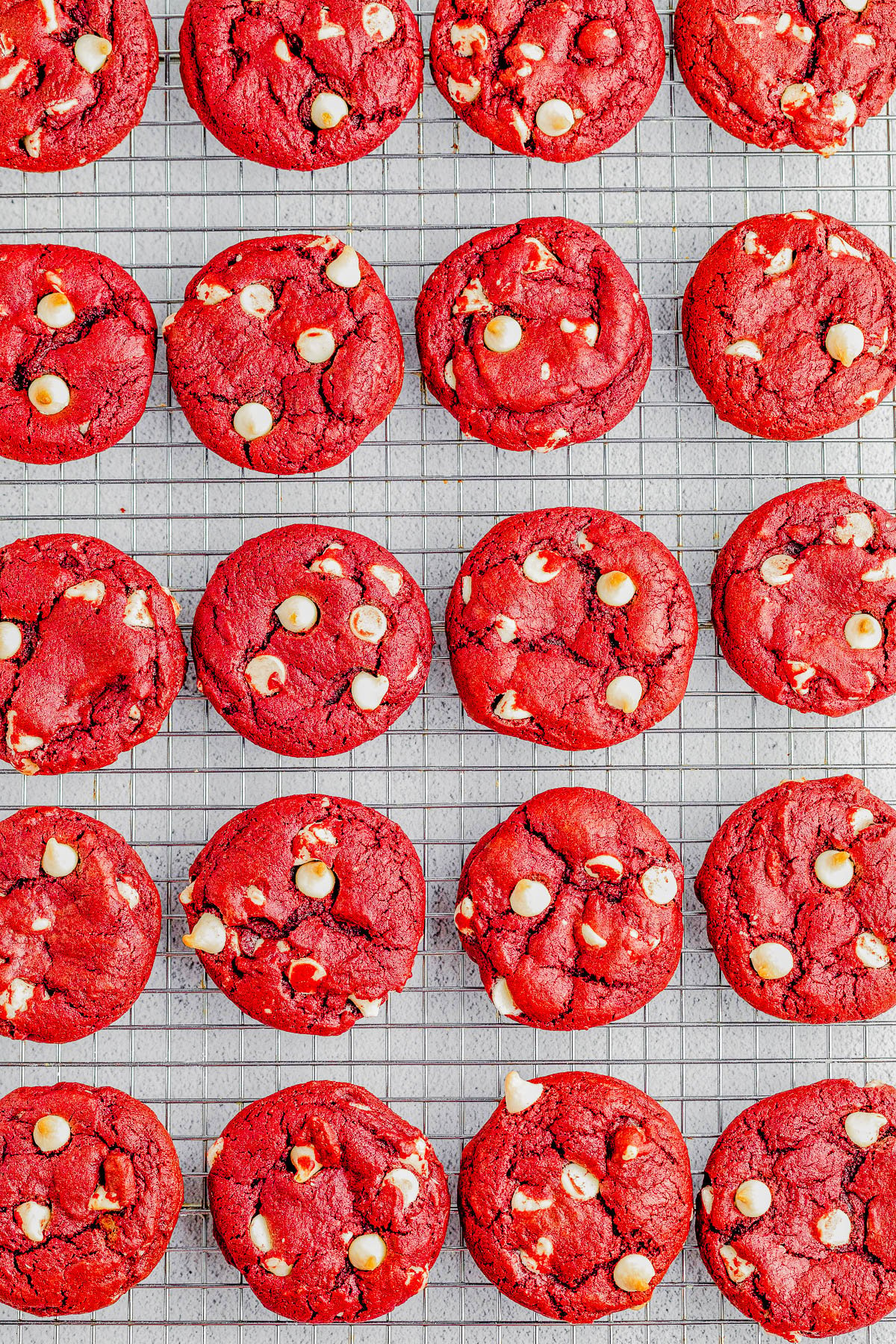 Red Velvet Cookies — Soft and chewy red velvet cookies that are loaded with white chocolate chips in every bite! A classic from-scratch red velvet cookie recipe that’s made in one bowl and EASY to make with PERFECT results every time! Perfect for Valentine’s Day, Christmas, or anytime you’re craving red velvet because these come together in no time and everyone LOVES them!