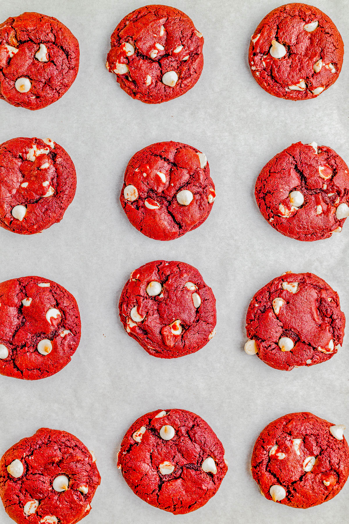Red Velvet Cookies — Soft and chewy red velvet cookies that are loaded with white chocolate chips in every bite! A classic from-scratch red velvet cookie recipe that’s made in one bowl and EASY to make with PERFECT results every time! Perfect for Valentine’s Day, Christmas, or anytime you’re craving red velvet because these come together in no time and everyone LOVES them!