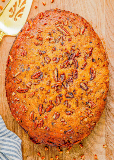Slow Cooker Chocolate Chip Banana Bread - Think slow cookers are only for soups and savory recipes? Think again because you can make this soft, tender, moist banana bread in your Crockpot and it's SO EASY! This no-mixer banana bread is loaded with chocolate chips in every bite and a family FAVORITE! Now you know what to do with your ripe bananas!