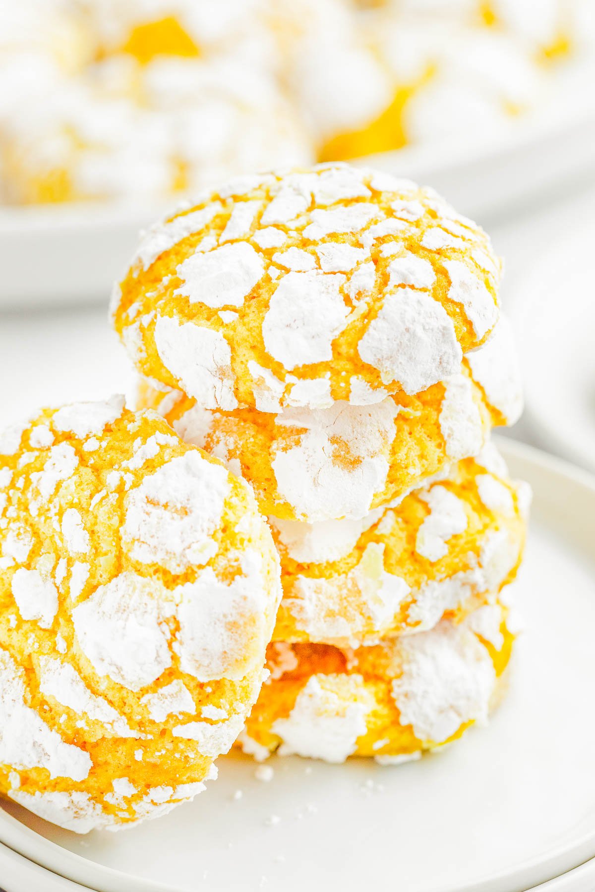 Lemon Crinkle Cookies — Lemon crinkles are pillowy soft on the inside and chewy on the outside, with slightly crispy edges from the powdered sugar coating! They taste like lemon bars, but in cookie form! The dough is flavored with lemon three ways and is perfect for holiday gatherings, Easter, Mother’s day, or whenever you’re craving an EASY lemon dessert 🍋!Lemon Crinkle Cookies — Lemon crinkles are pillowy soft on the inside and chewy on the outside, with slightly crispy edges from the powdered sugar coating! They taste like lemon bars, but in cookie form! The dough is flavored with lemon three ways and is perfect for holiday gatherings, Easter, Mother’s day, or whenever you’re craving an EASY lemon dessert 🍋!