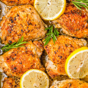 Baked Lemon Rosemary Chicken — Just five basic ingredients are all you need to make this EASY recipe! Chicken thighs are seared until golden, then coated with a zingy lemon rosemary marinade and baked. The skin crisps up in the oven while the chicken remains moist and tender! Serve with a side salad, roasted veggies, or mashed potatoes for a full meal! 