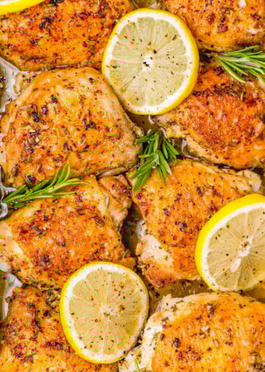 Baked Lemon Rosemary Chicken — Just five basic ingredients are all you need to make this EASY recipe! Chicken thighs are seared until golden, then coated with a zingy lemon rosemary marinade and baked. The skin crisps up in the oven while the chicken remains moist and tender! Serve with a side salad, roasted veggies, or mashed potatoes for a full meal! 