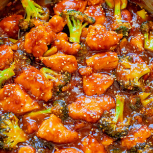 A pot of sticky chicken with broccoli.
