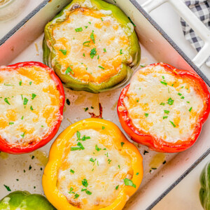 Stuffed Bell Peppers with Ground Beef and Rice — Sweet bell peppers are stuffed with a mixture of Italian sausage, ground beef, rice, and veggies then topped with CHEESE! This is a great meal prep recipe that comes in handy on busy weeknights! EASY, hearty, comfort food that the whole family will love!