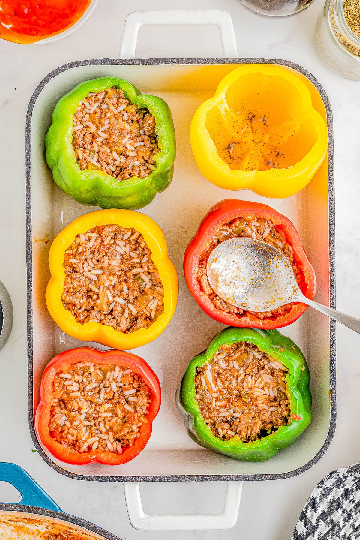 Stuffed Bell Peppers with Ground Beef and Rice — Sweet bell peppers are stuffed with a mixture of Italian sausage, ground beef, rice, and veggies then topped with CHEESE! This is a great meal prep recipe that comes in handy on busy weeknights! EASY, hearty, comfort food that the whole family will love!