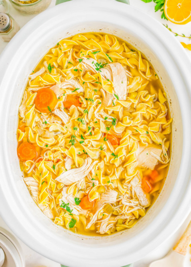 Chicken noodle soup in a slow cooker.