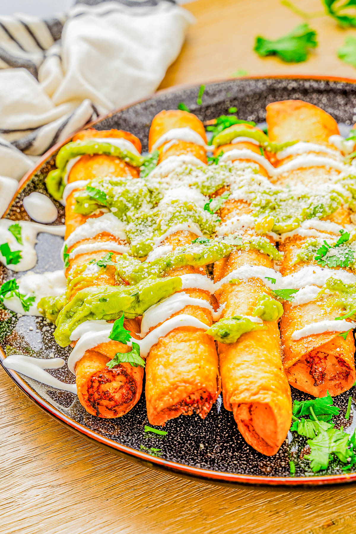 Chicken Taquitos - 🌮🧀🥑 Learn how to make the BEST tasting taquitos at home that rival a Mexican restaurant in just 30 minutes with a handful of common ingredients! Crispy and crunchy on the outside, warm melted cheese and seasoned chicken on the inside, these will be a hit at your next fiesta or casual get-together! Instructions provided to bake, air fry, or fry so you're set to make this EASY recipe!