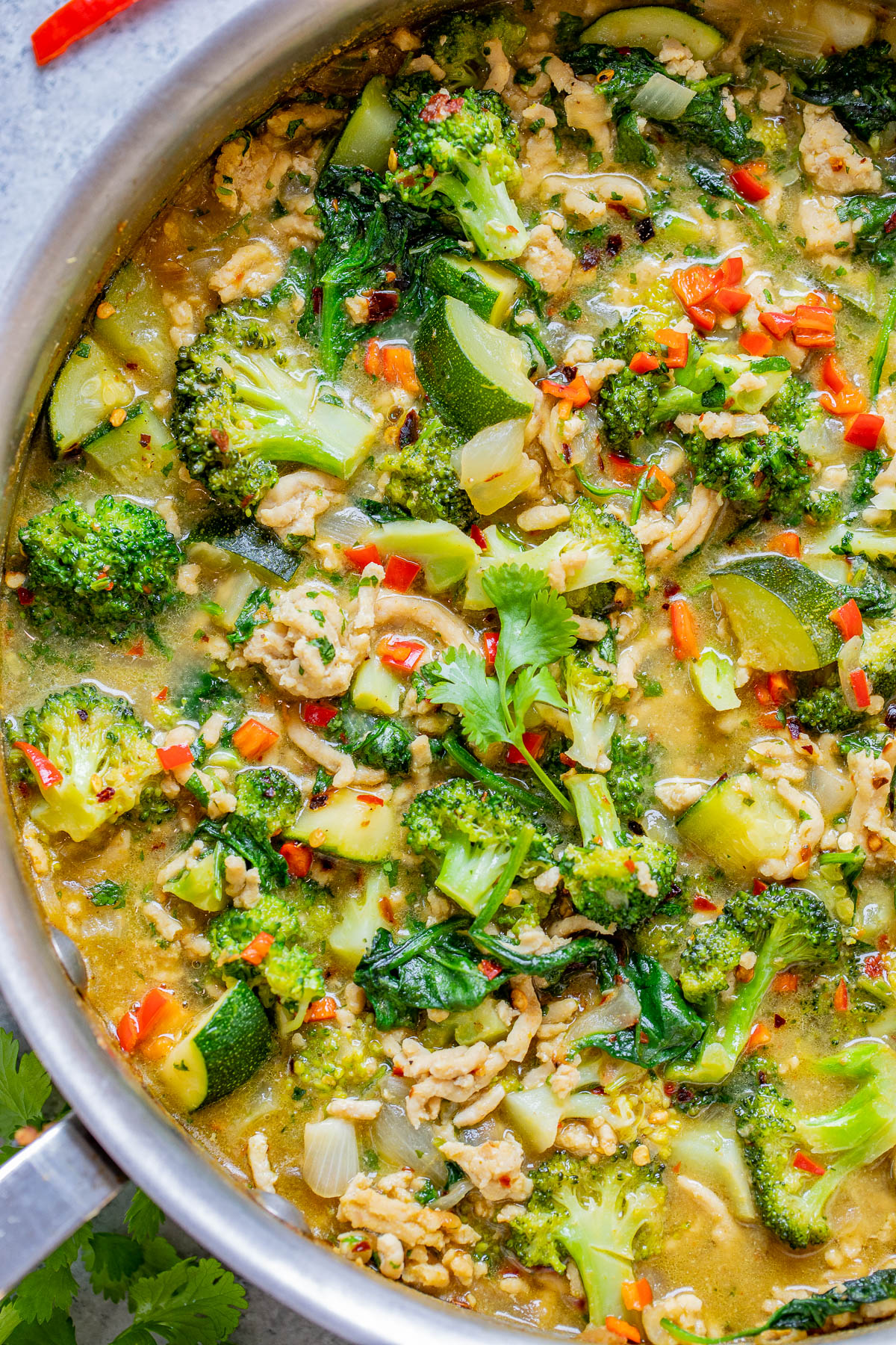A green chicken and broccoli curry with herbs and spices.