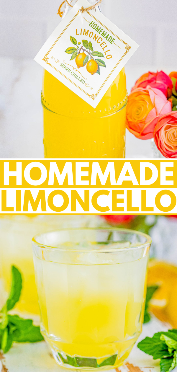 A bottle of homemade limoncello with a glass serving, surrounded by fresh lemons and decorative flowers.