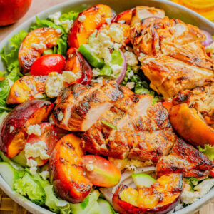Grilled Peach and Chicken Salad with Lemon Vinaigrette in a bowl.