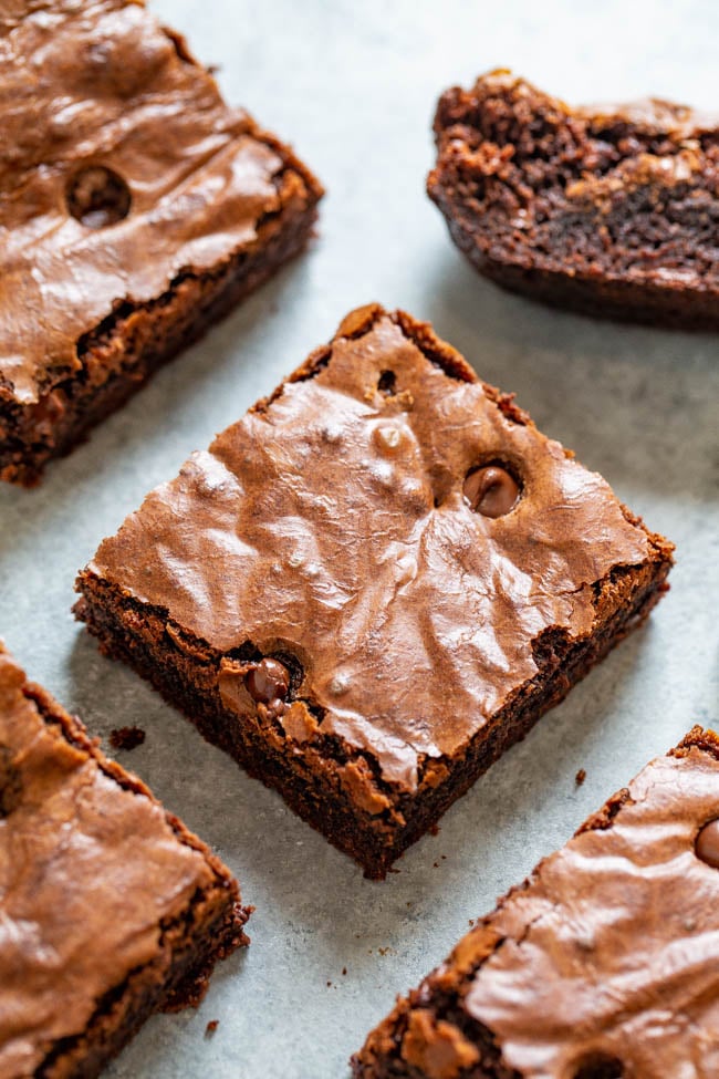 Boyfriend Brownies - Thick, rich, and a chocolate lovers dream!! Fudgy in the center with chewy edges and studded with chocolate chips! If you're craving chocolate, this EASY homemade brownie recipe is just what you need!!
