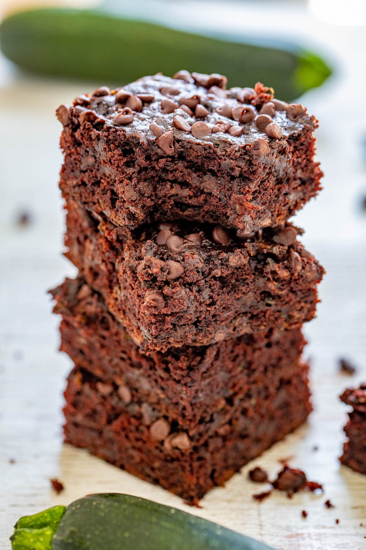 Zucchini Brownies - The BEST zucchini brownies that are EASY, made in one bowl, and no mixer required! Soft, fudgy, and almost taste like rich chocolate cake. They're filled and topped with mini chocolate chips to add even more fabulous chocolate flavor. And NO, you cannot taste the zucchini at all - promise!