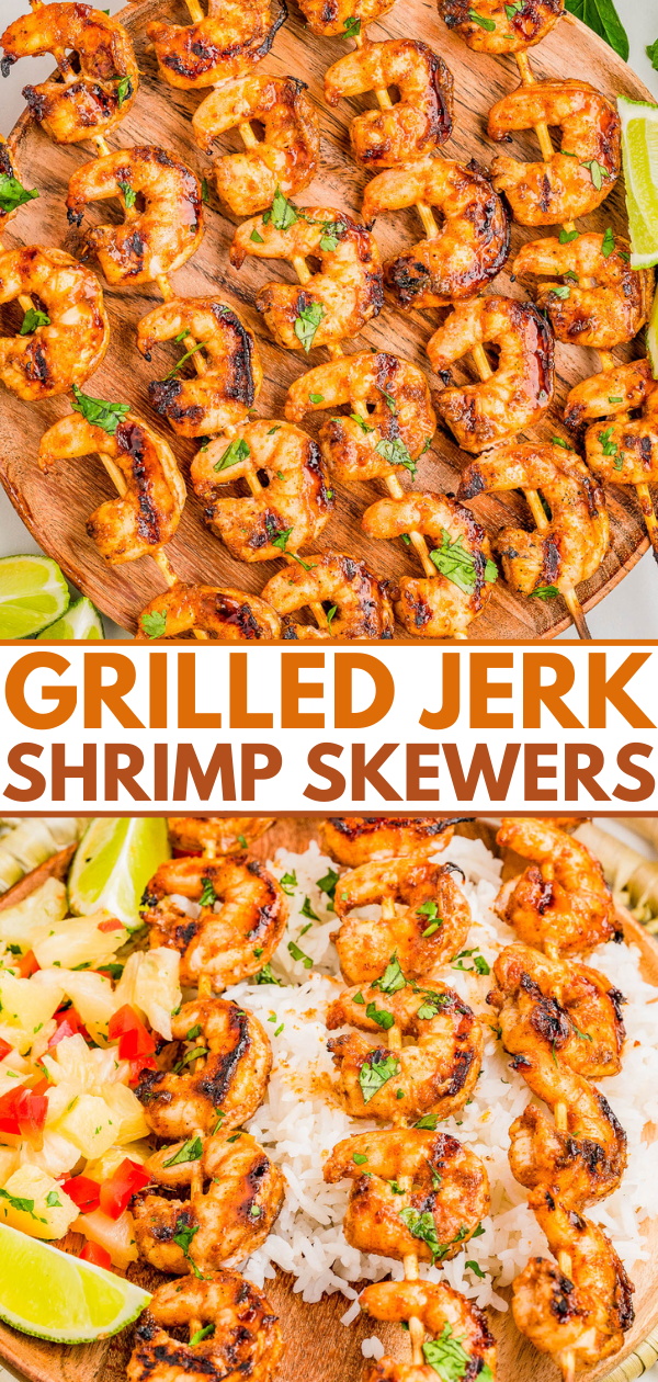 Grilled jerk shrimp skewers served on a wooden platter with lime wedges and garnished with herbs, with a side of rice and pineapple salsa.