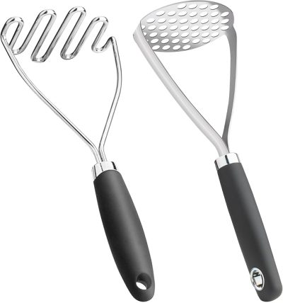 Two metal potato mashers with black handles; one has a wavy wire design and the other has a perforated flat plate.
