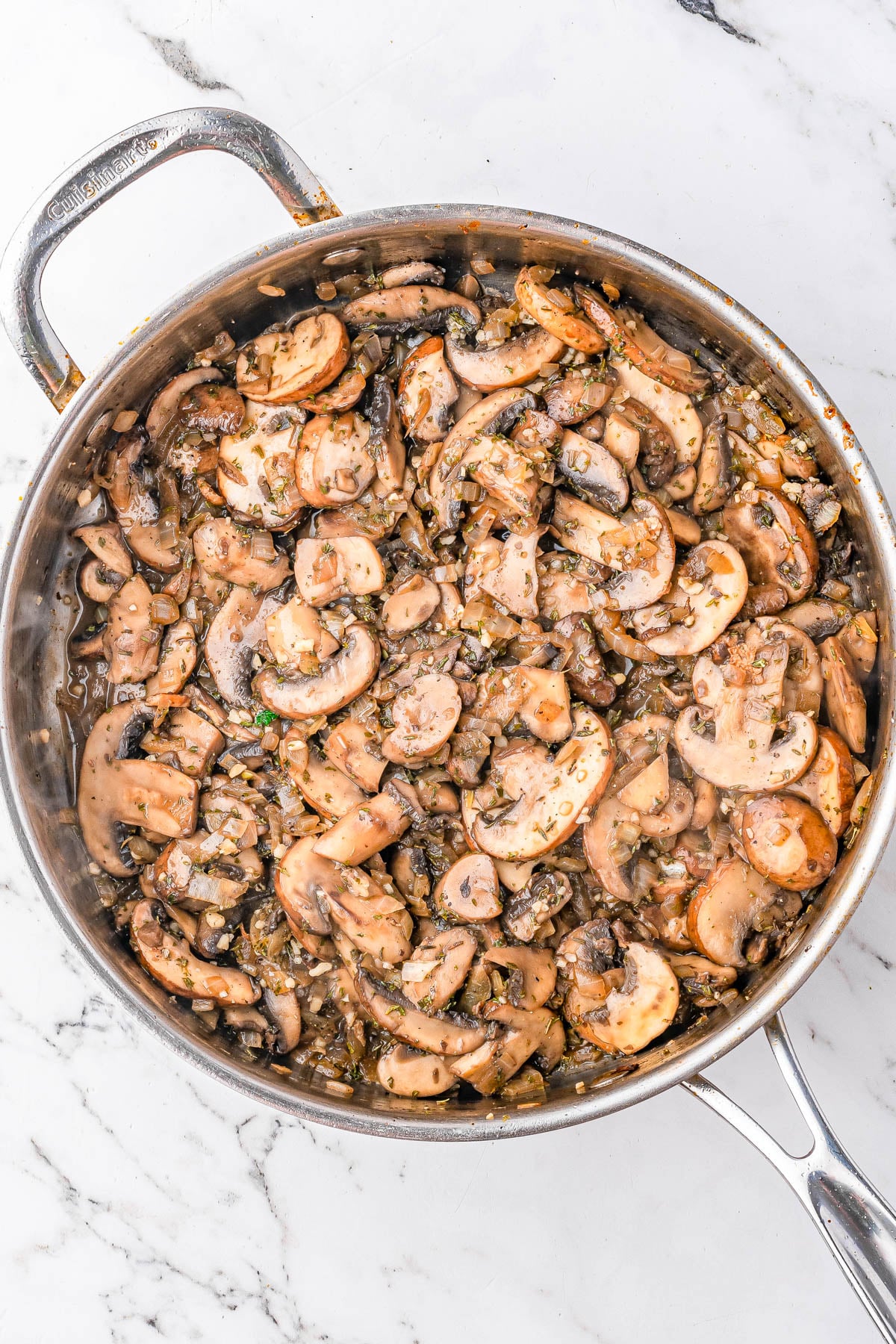A pot of mushrooms and spices.
