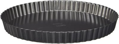 Round, black, nonstick tart pan with fluted edges and removable bottom, shown empty against a white background.
