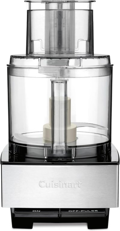 A Cuisinart food processor with a clear plastic bowl, white central blade, and stainless steel base featuring on and off/pulse buttons.