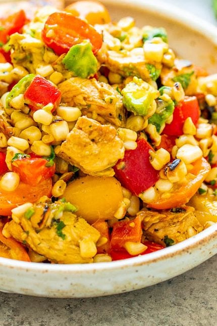 Grilled Chicken and Corn Salad -  An EASY salad that’s ready in 15 minutes and you won’t be able to stop eating it!! Tender chicken, juicy corn, crisp bell peppers and tomatoes, creamy avocado, cilantro, and fresh lime juice for the WIN!!