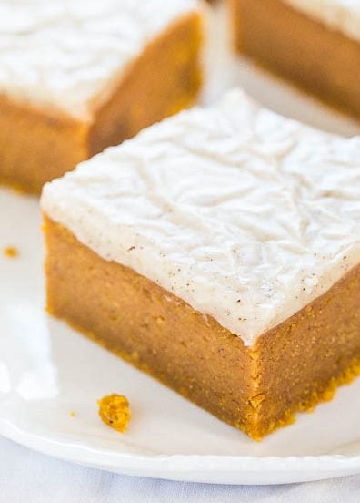 Fudgy Pumpkin Spice Bars — Moist pumpkin bars so soft they're like biting into pumpkin fudge!! The glaze is ahh-mazing!!!