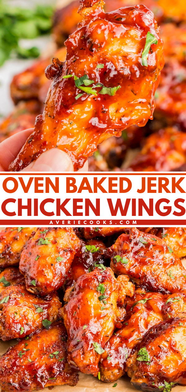 Close-up of glazed jerk chicken wings, garnished with chopped herbs, with a hand holding one wing above a pile of more wings. Text reads: Oven Baked Jerk Chicken Wings.