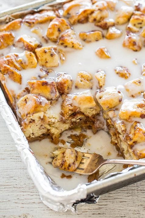 Pumpkin Cinnamon Roll Bake in a baking dish. one slice is missing.