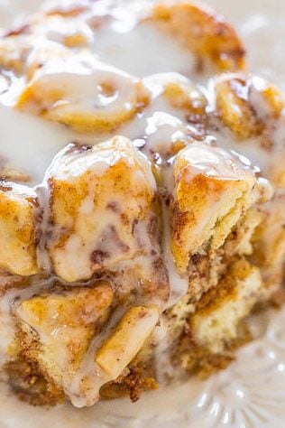 slice of pumpkin cinnamon roll breakfast casserole on a white plate