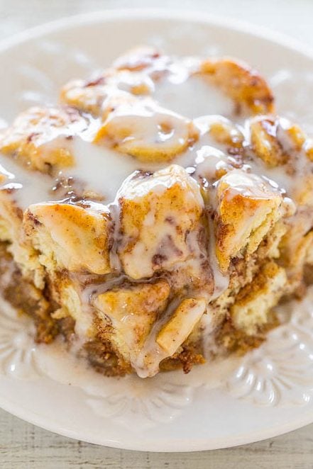 slice of pumpkin cinnamon roll breakfast casserole on a white plate