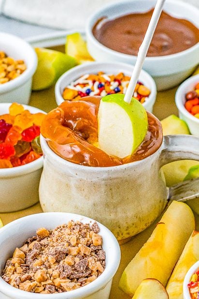 Caramel Apple Bar — It's caramel apple season and this caramel apple bar is a FUN and festive quintessential fall treat! EASY to prep and it's a wonderful family family-friendly activity for kids and adults alike!